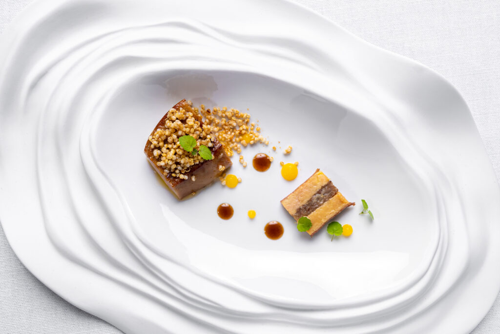 Roasted foie gras with tongue tart, roasted onion and spiced pumpkin jus, a dish by Ola Martín Berasategui in Bilbao.